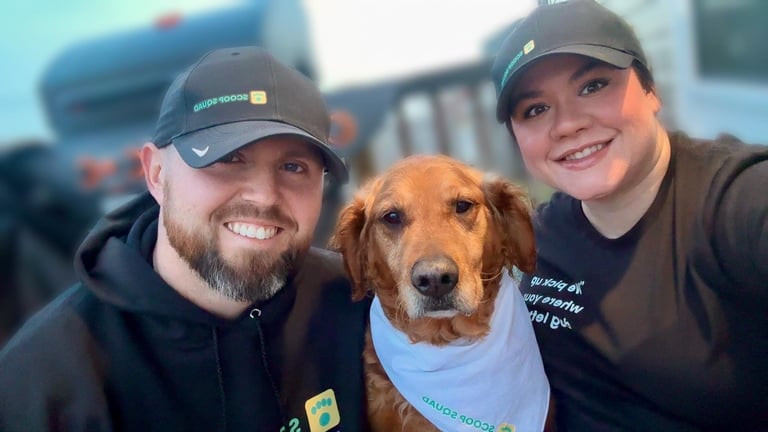 Mark, Baillie & Reece — the family behind Scoop Squad with their golden-brown dog wearing a bandana outdoors